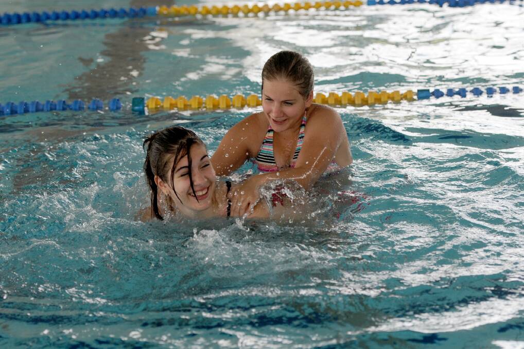 DECEMBER: Sisters Victoria and Jessica Nanninga keep cool at the Horsham Aquatic Centre.