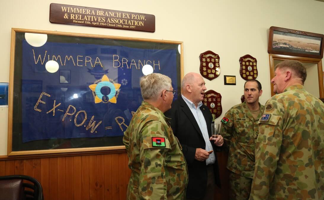 Mick Baldwin, David Blair and Stuart Chilver talk with Governor-General Peter Cosgrove at the Horsham RSL. Picture: THEA PETRASS