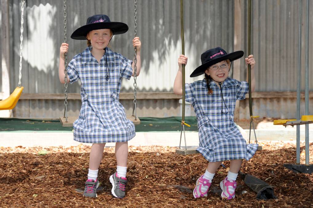 JANUARY: Twins Claire and Breanna Martin prepare for the start of school at Horsham West Primary School.