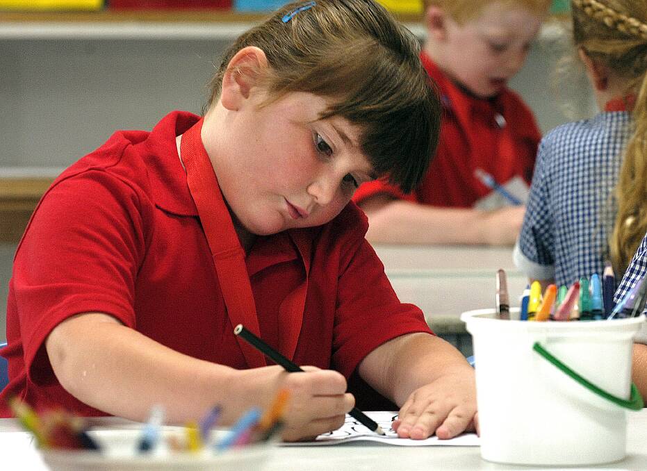 2008: Harmony Hodgson works on a drawing at Horsham 298 Primary School.