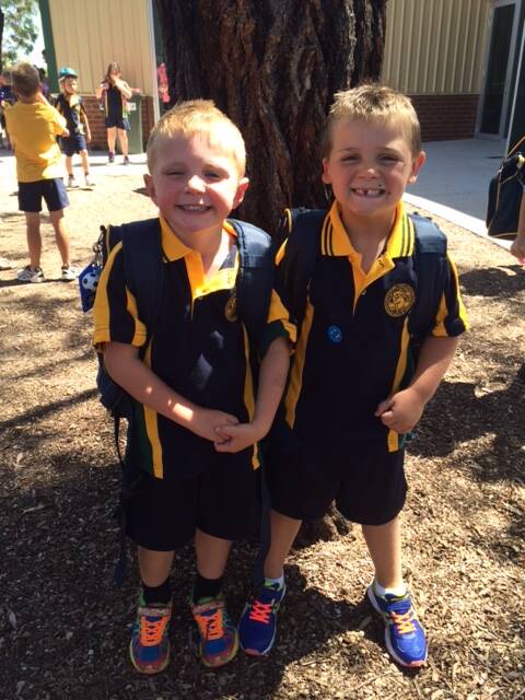 Best buddies Finn Miller and Jack Henry celebrate the first day of prep at Horsham West Primary School.