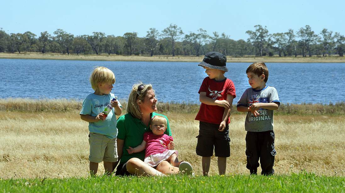 FAMILY HOPES: Sara McDonnell with her children William, Eliza and Tom at Lake Wallace in 2010. Family friend Clancy Shirrefs is also pictured, far right, enjoying the lake at Edenhope. Picture: PAUL CARRACHER