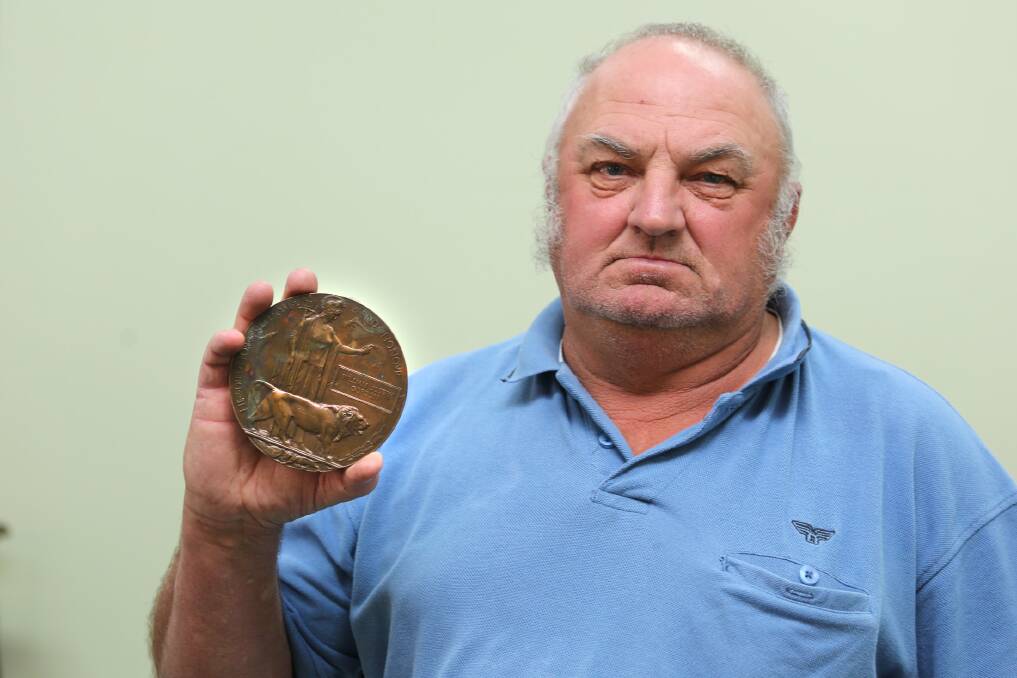 MONUMENTAL FIND: Bungalally man Barry Mackley displays a First World War memorial plaque he found in a Horsham tip four decades ago. Picture: THEA PETRASS