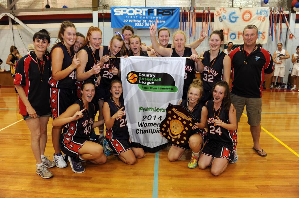 PREMIERS: The Horsham Hornets women claimed their first ever premiership on Saturday night with a win over Portland in the Country Basketball League south-west conference grand final. Pictured, from back left, Gianna Sudholz, Emalie Iredell, Jedda Heard, Chloe Bibby, Faith McKenzie, Caitlin Story, Georgia Hiscock, Emma Nikkerud, coach Sharon Fedke, Madison Iredell and assistant coach Gareth Hiscock; front, Mikayla McAuliffe, Ash Grace, Aily McAuliffe and Alexandra Hiscock. Picture: PAUL CARRACHER