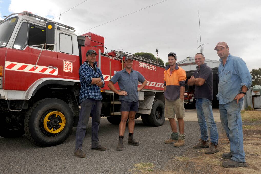 CALL FOR DONATIONS: Brimpaen Fire Brigade captain Rod Miller, second lieutenant Luke Dunn, third lieutenant Gerard Matthews, fourth lieutenant Anthony Smith and secretary-treasurer Andrew Chincarini with the fire truck that is now past its use-by date. Picture: SAMANTHA CAMARRI
