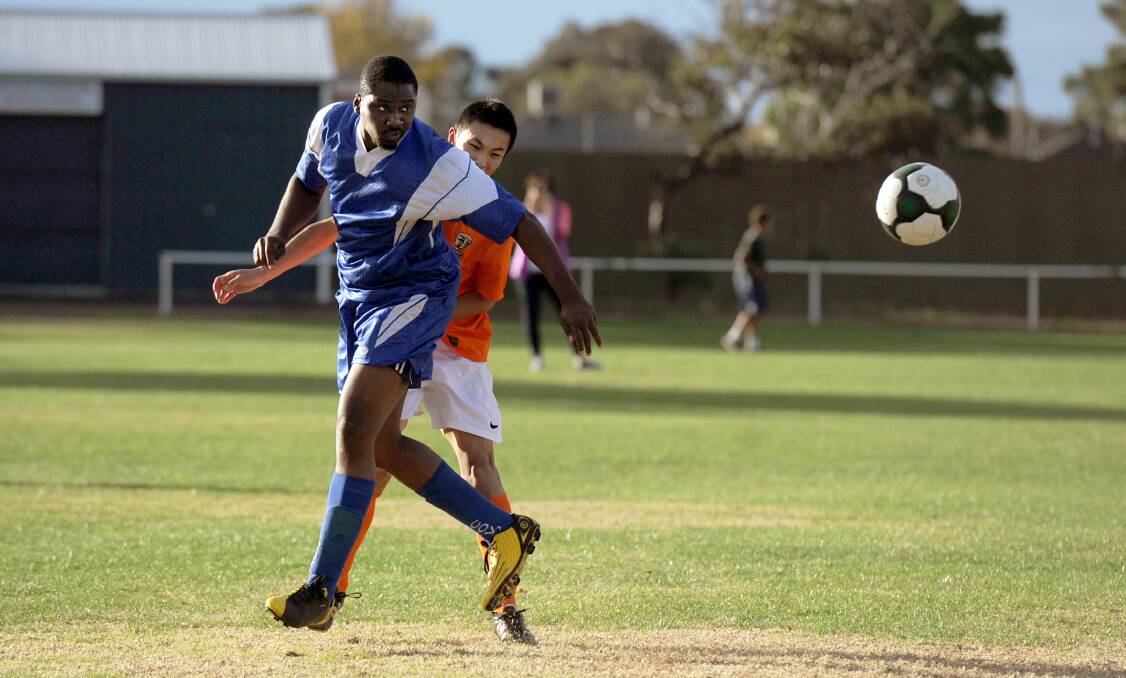 Horsham Falcon Kenneth Iroegbulam in action against Creswick's Eric Yan earlier this season. The Falcons ended up sixth overall. Picture: SAMANTHA CAMARRI