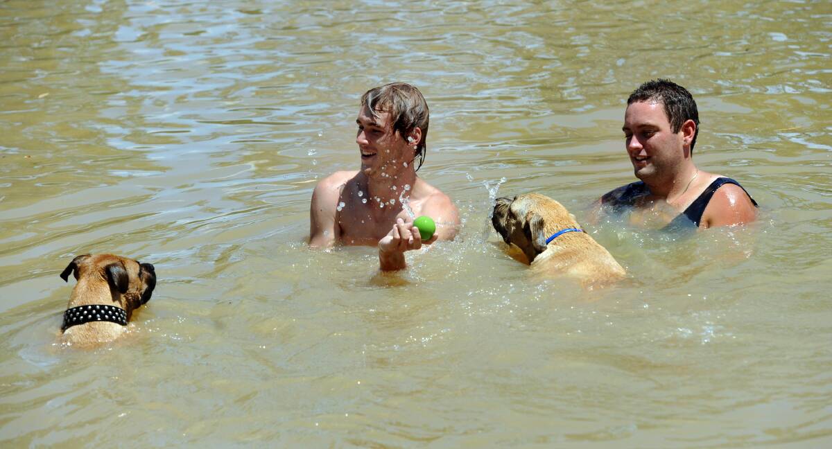 JANUARY: Nathan Slorach and Bryce McBride enjoy a dip in the Wimmera River near Farrar Avenue, Horsham.
