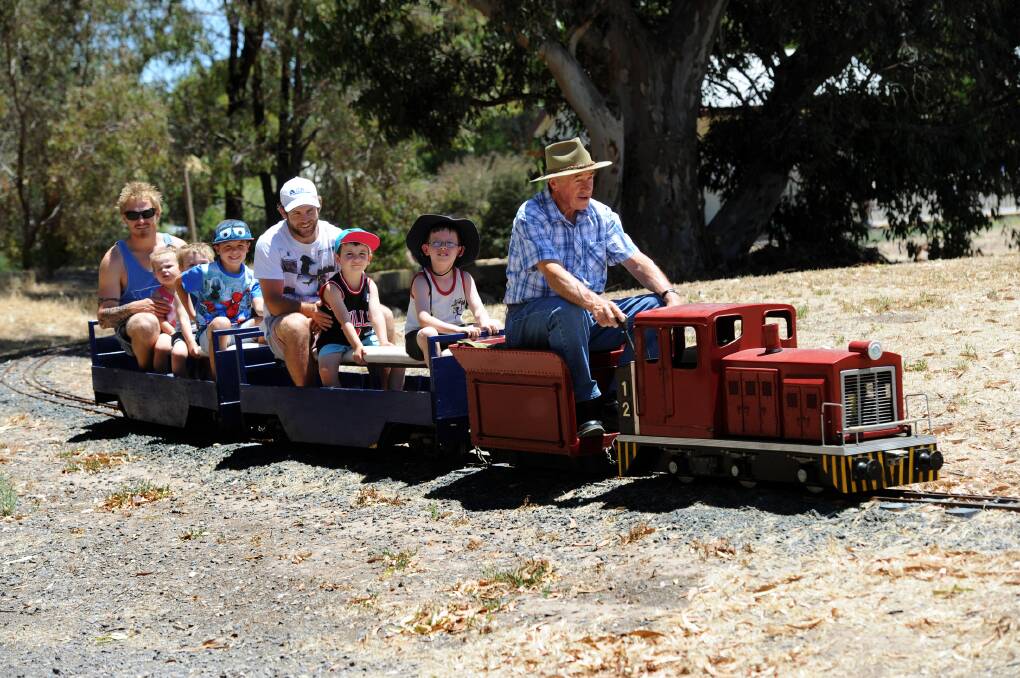 JANUARY: Neville Price gives from right, Austin Jones, Chaz Smith, Jye Smith, Cooper Jardine, Jaega McCall, Makiah McCall and Jai McCall a ride at Sawyer Park Miniature Railway.