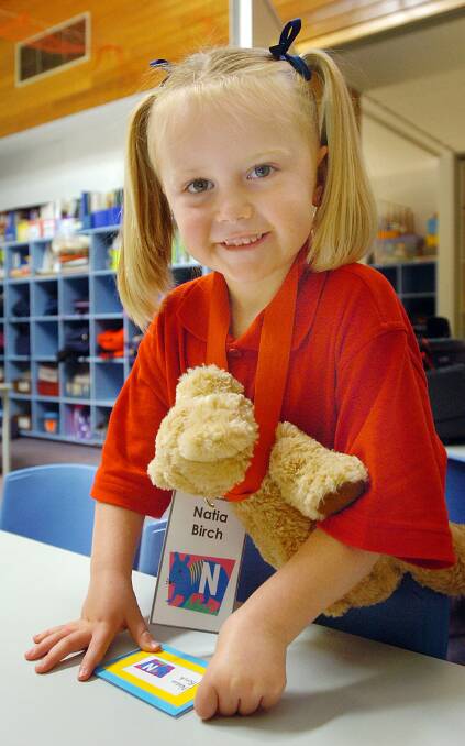 2007: Natia Birch, 4, sticks her name onto a desk during her first day of prep at Horsham 298 Primary School.