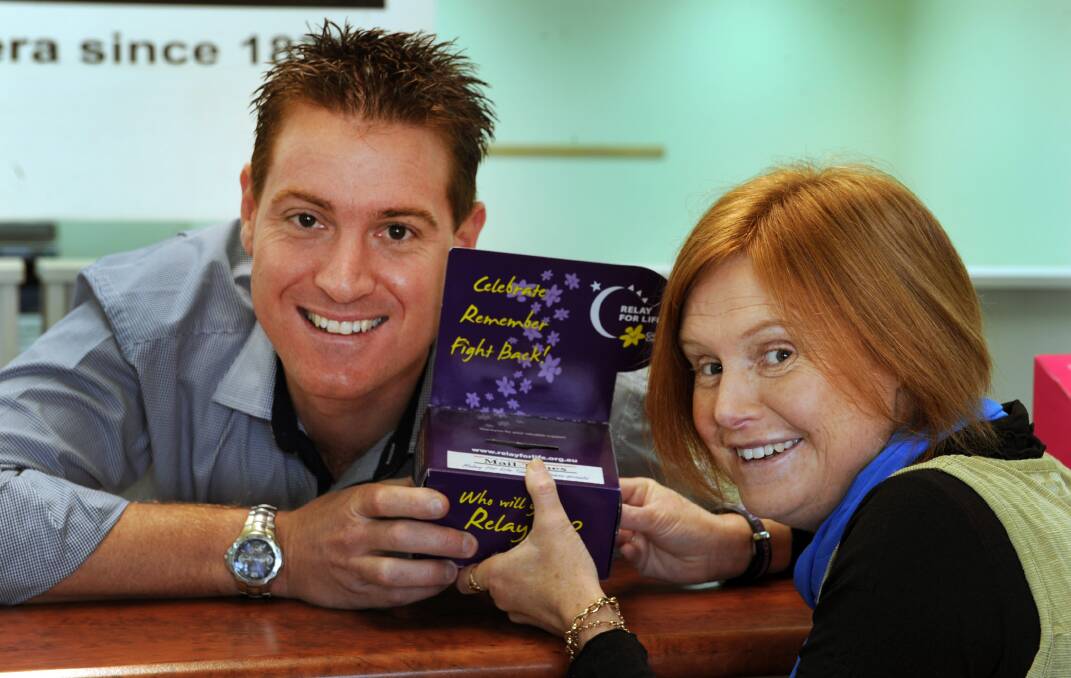 PROMOTION: Wimmera Mail-Times advertising manager Clint King and Relay For Life committee Felicity Taylor gear up for Paint the Town Purple. Picture: PAUL CARRACHER