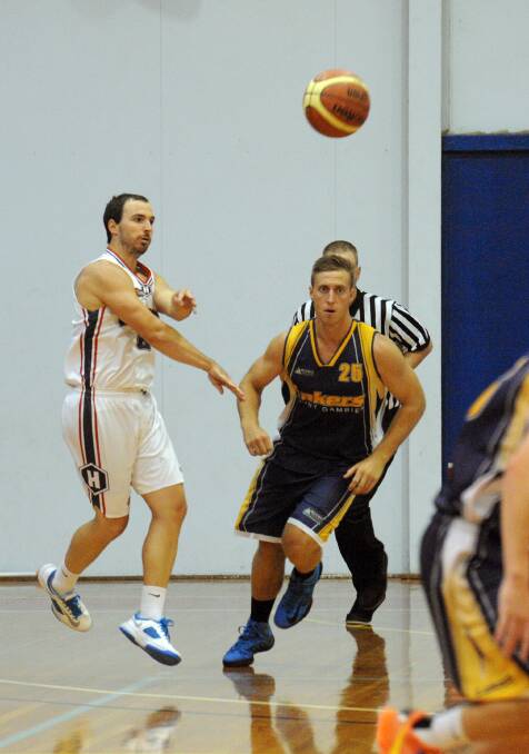 IN THE AIR: Horsham Hornets' Cam Bruce and Mount Gambier's Joe Ferguson-Lane during the grand final on Saturday night.