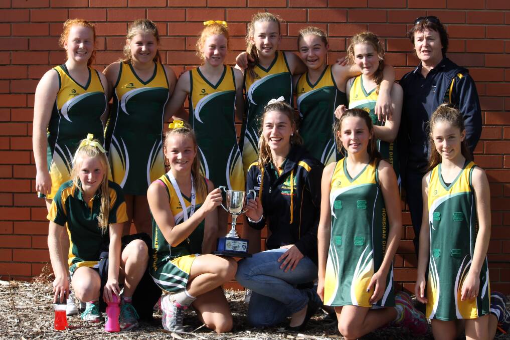 13 AND UNDER: The winning Horsham team. From back left, Meg Carter, Abbie Bell, Holly Smith, Pip Lees, Caitlyn Ridgway, Paschale Shirrefs and team manager Maureen Ervin; front, Katie Price, Jordie McAuliffe, coach Nikki Ervin, Ella Motton and Lavinia Fox.