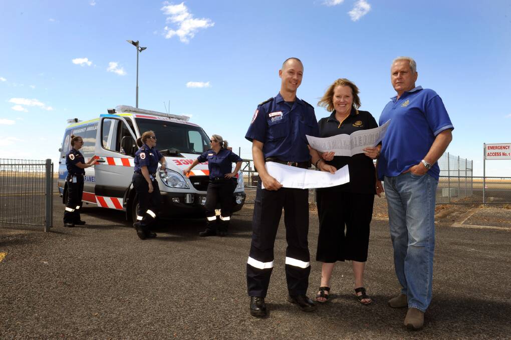FEBRUARY: Paul Burton, Jenny Reid and Philip Nicks with plans for a patient transfer station at Horsham Aerodrome.