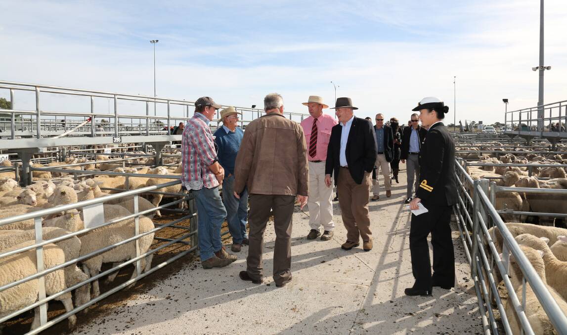 Governor-General Peter Cosgrove speaks with farmers Leigh Funcke, Brendan Hogan, Horsham Mayor David Grimble and Andrew Adamson at the Horsham Regional Livestock Exchange. Picture: THEA PETRASS