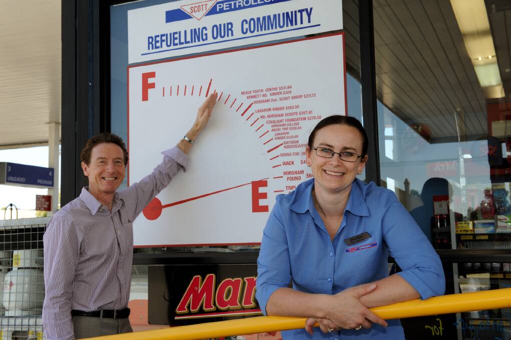 COMMUNITY SPIRIT: Wimmera Uniting Care chief executive Barrie Elvish and Scott Petroleum’s Holly Winfield are pleased donations for Wimmera Uniting Care’s Bushfire Appeal have topped $25,000. Scott Petroleum donated $2878.62 to the appeal this week. Picture: PAUL CARRACHER