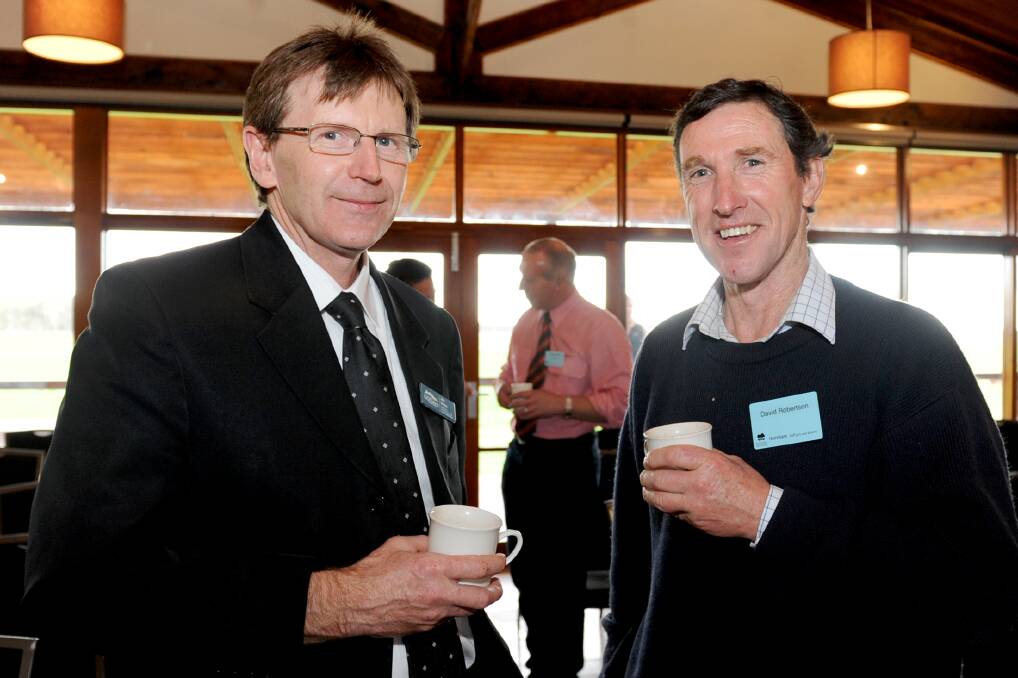 Northern Grampians Shire's Jim Nolan, left, with Coleraine's David Robertson. Picture: SAMANTHA CAMARRI