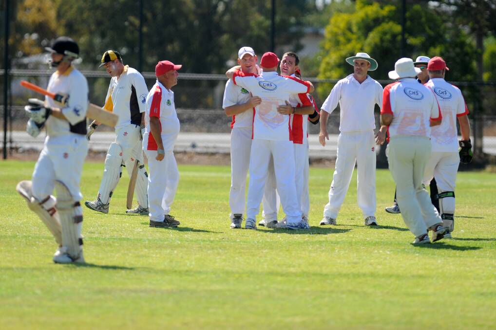 Homers celebrate getting Jung Tiger Greg Eagle out during the C Grade grand final.
