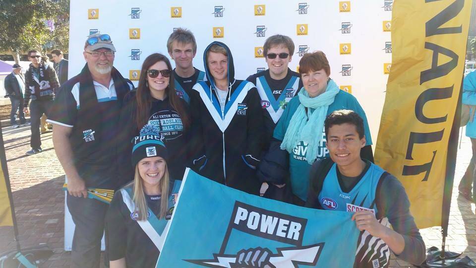 A Port Adelaide membership is an important part of Australian life - even French exchange student Maxime Tanghe, right, agreed.