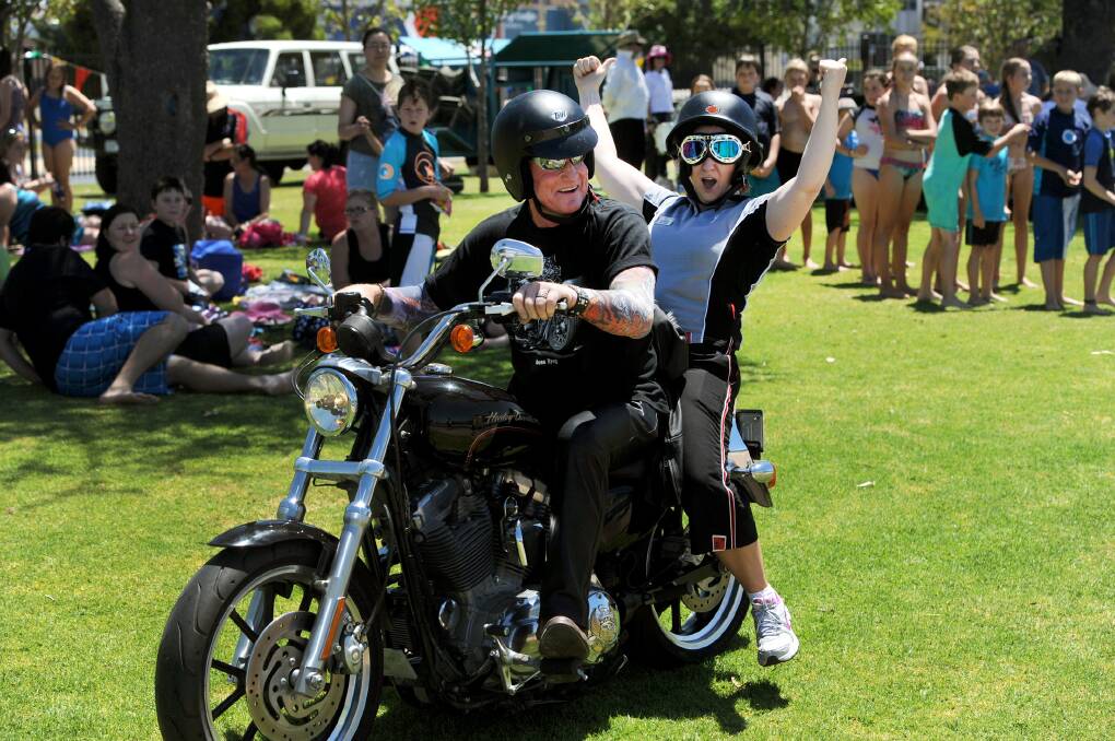 JANUARY: Mick Finnigan gives Sharon McDonald a Harley ride at Horsham Aquatic Centre Pool Party.