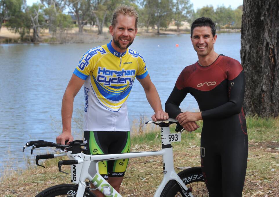 IRONMEN: Cameron Evans and Mark Pumpa prepare for an ironman event last year. Picture: PAUL CARRACHER