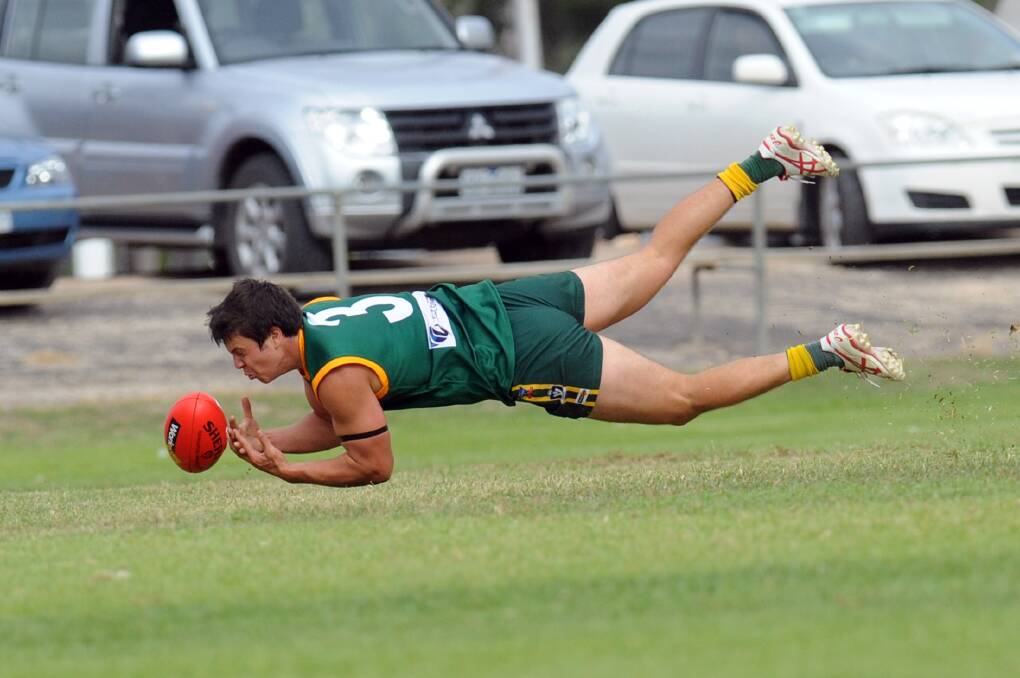 OUT OF REACH: Dimboola forward Lachie Exell dives against Minyip-Murtoa at Dimboola Recreation Reserve on Saturday. The Roos, who won last year’s Wimmera Football League flag, are now winless from two games after losing to the Burras by 14 points. Pictures: PAUL CARRACHER