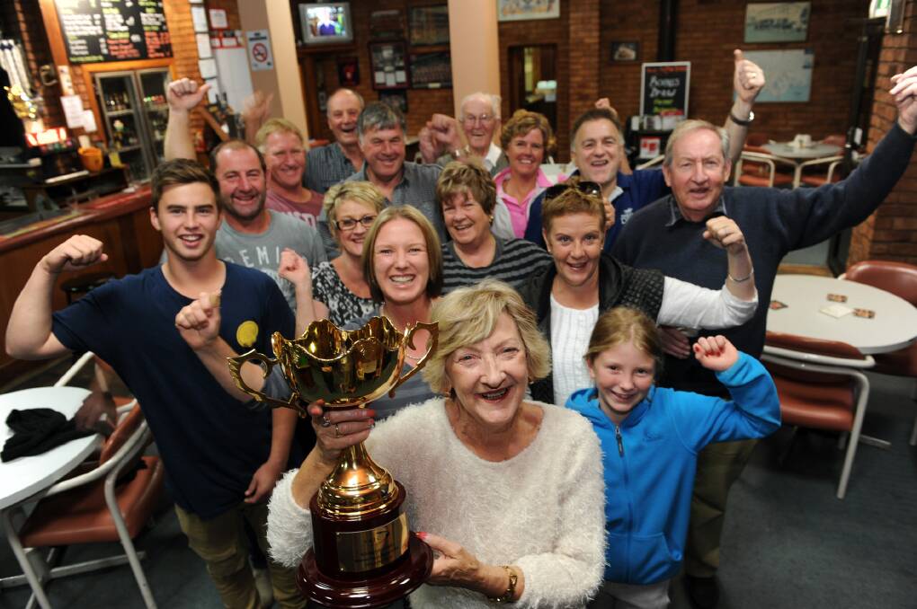 TELL HIM WE’RE DREAMING: Worrall Dunn’s wife Lorraine Dunn holds May’s Dream Australasian Oaks trophy as the owners celebrate at the White Hart Hotel in Horsham. Picture: PAUL CARRACHER