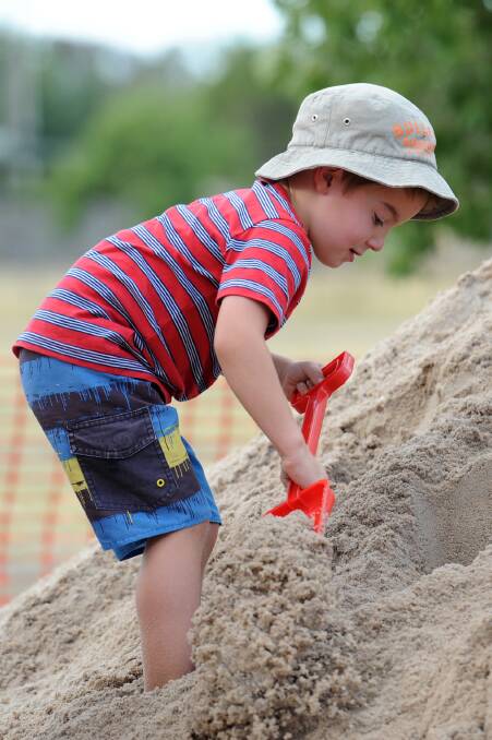 BURIED TREASURE: Horsham's Will Robertson, 5, works hard at Sunday's diamond dig fundraiser at the Wimmera River.