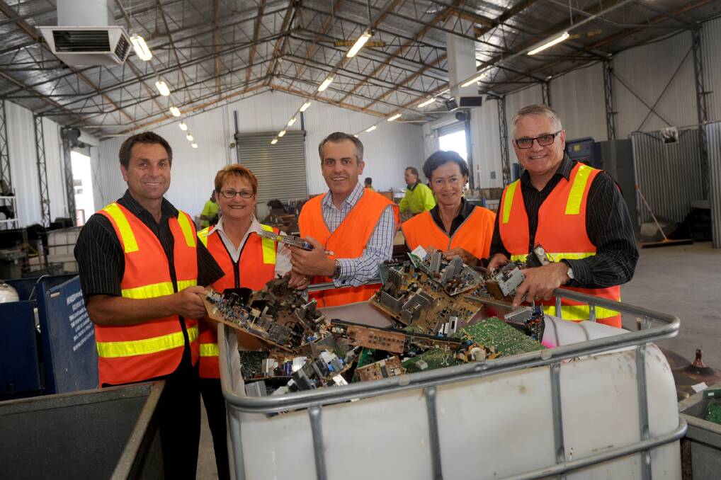 RECYCLING DRIVE: Pictured from left are Axis Worx manager Bill Schmidt, employment services manager Viv Watson, Sustainability Victoria chief executive Stan Krpan, Sustainability Victoria Grampians regional co-ordinator Trish Kevin and Axis Worx corporate services manager Graeme Eldridge. Picture: SAMANTHA CAMARRI