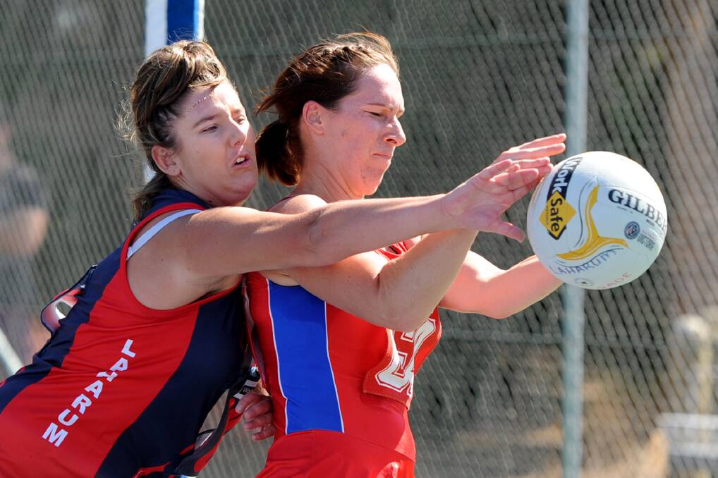 NETBALL IS BACK: Laharum defender Kayla Hawker and Kalkee’s Melissa Beddison fight for the ball during round one of Horsham District netball action at the weekend. Pictures: SAMANTHA CAMARRI
