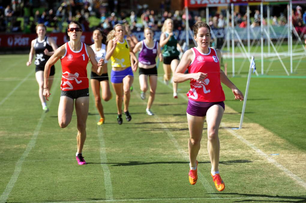 CLOSE FINISH: Celia Cosgriff beats Lauren Wells in a 400-metre heat at Sunday's Stawell Gift family day.