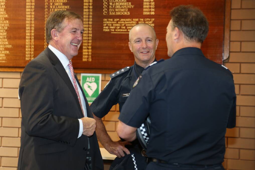 Member for Lowan Hugh Delahunty, Horsham Inspector Trevor Ashton and Senior Sergeant Brendan Broadbent share a laugh at a Grampians bushfire civic reception on Tuesday.