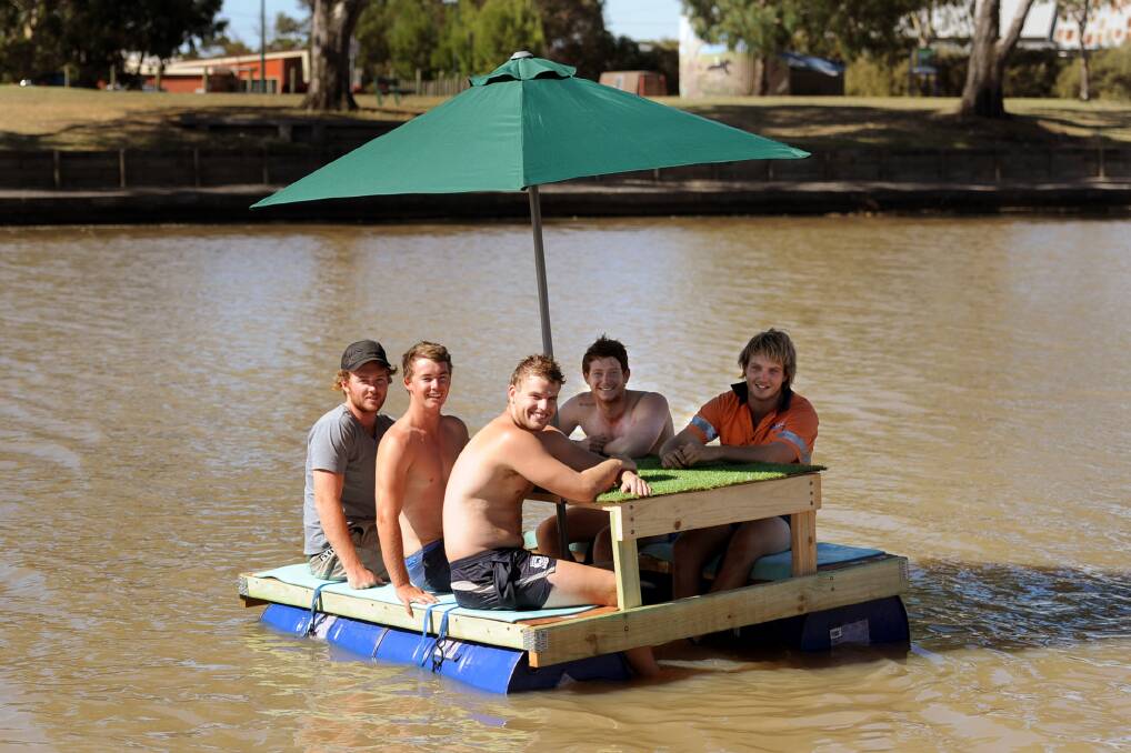 WHATEVER FLOATS YOUR BOAT: A group of Horsham friends created a floating picnic table after seeing a similar model on Facebook. Pictured, from left, are Ben Hobbs, Will Burgess, Tyler McRae, Alex Bryan and Liam Niewand. Picture: SAMANTHA CAMARRI