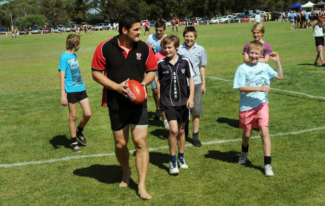 Brendan Fevola with his followers before the Edenhope-Apsley v Noradjuha-Quantong match.