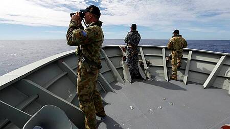Gunner Richard Brown of Transit Security Element on lookout on the forecastle of HMAS Perth in search of debris from missing Malaysia Airline Flight MH370 during Operation Southern Indian Ocean. Picture: CONTRIBUTED