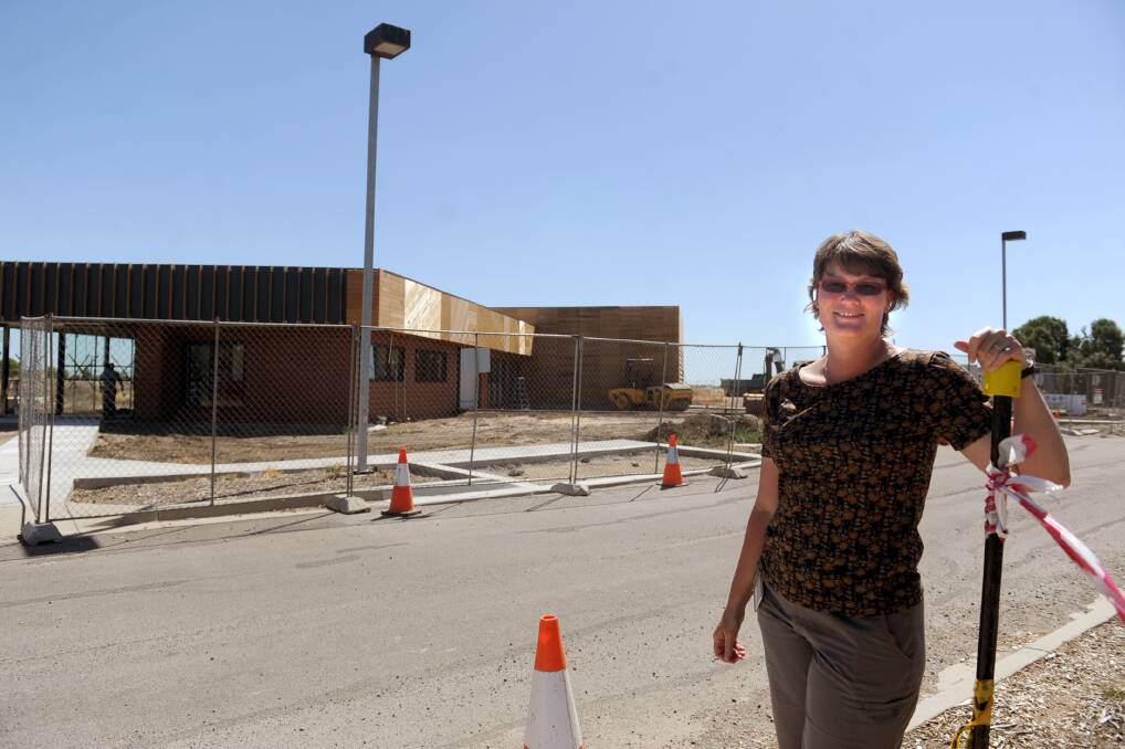 Australian Grains Genebank leader Sally Norton in front of the new building during construction. The seed bank officially opens on Friday. Picture: SAMANTHA CAMARRI