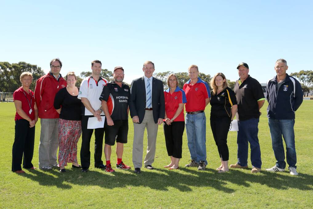 SAFE SPENDING: Laharum Football Netball Club’s Nadine Miller, Taylors Lake Football Netball Club’s Greg Fletcher, Pimpinio Football Netball Club’s Erin Emmett, Horsham Saints Cricket Club representatives Trent King and Tim Lannen, Member for Lowan Hugh Delahunty, Kalkee Football Netball Club’s Carley Gunn and Heath Martin, Pimpinio Football Netball Club’s Renee Clarkson and David O’Connor and AFL Victoria’s Bruce Petering welcome grants to improve safety at sports clubs. Pictures: THEA PETRASS