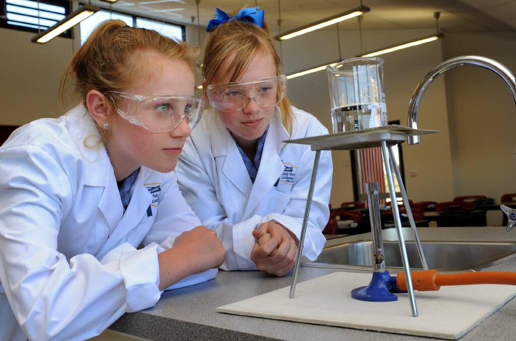 NEW TO CLASS: Holy Trinity Lutheran School year seven students Sarah Barber and Abbey Hawker enjoy the new science campus. The students are part of the middle school’s inaugural class. Pictures: PAUL CARRACHER