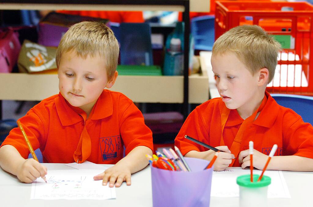 2007: New preps Thomas Mott, 5, and Brandon Ellis, 5, work on drawings during their first day of school at Horsham 298 Primary School.