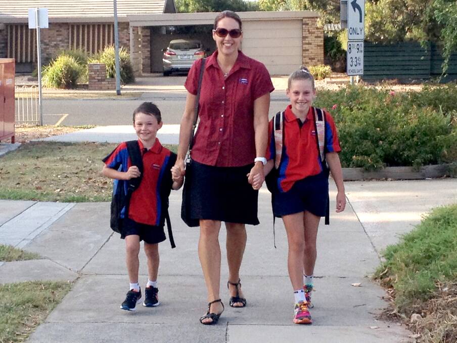 Amanda Worthy, and her two children, Ethan, 5 prep, Imogen, 8, year 3, ready for school at Horsham Primary School 298 campus.