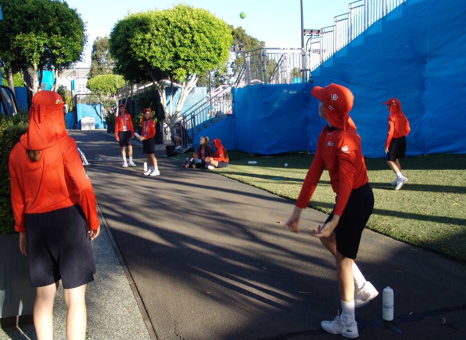 Archie and the other ballkids take a break with an impromptu game of cricket.