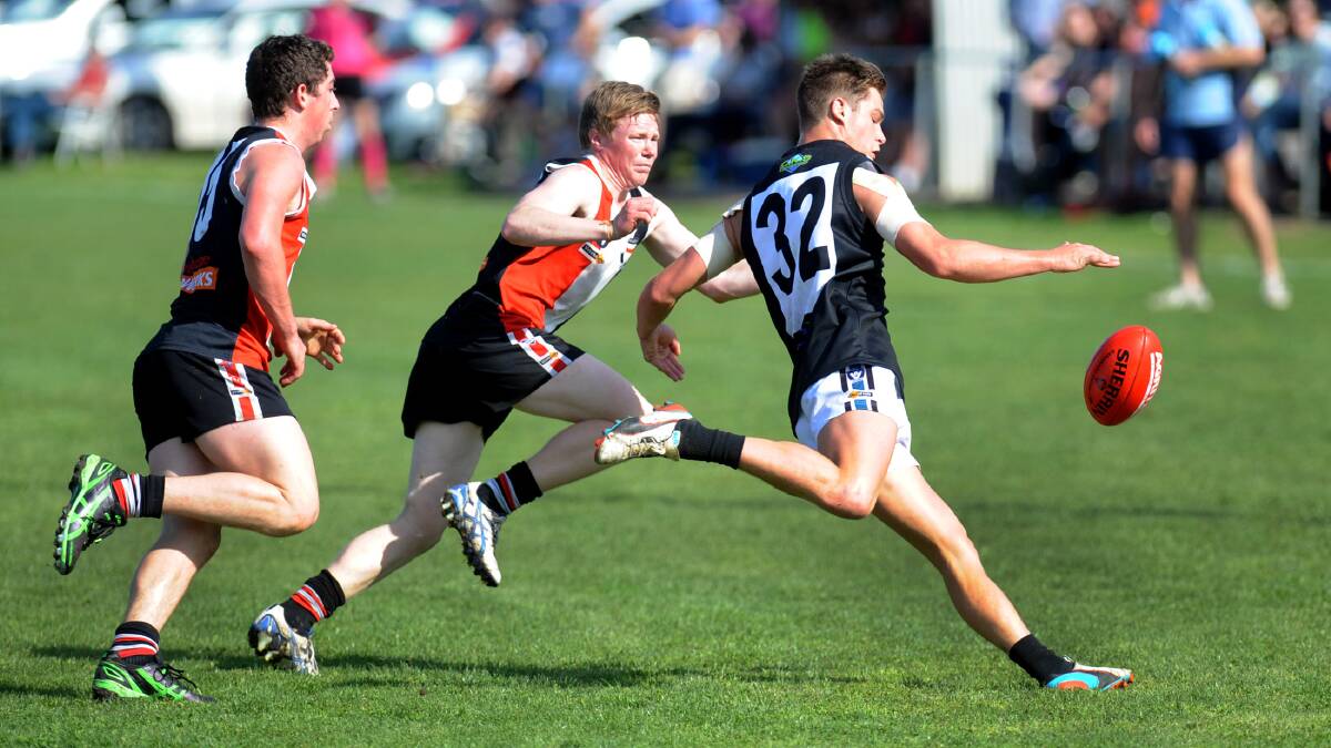 Swifts player Tom Ruggles evades Edenhope-Apsley's Ben Johnson in last year's HDFNL semi-final. Picture: PAUL CARRACHER