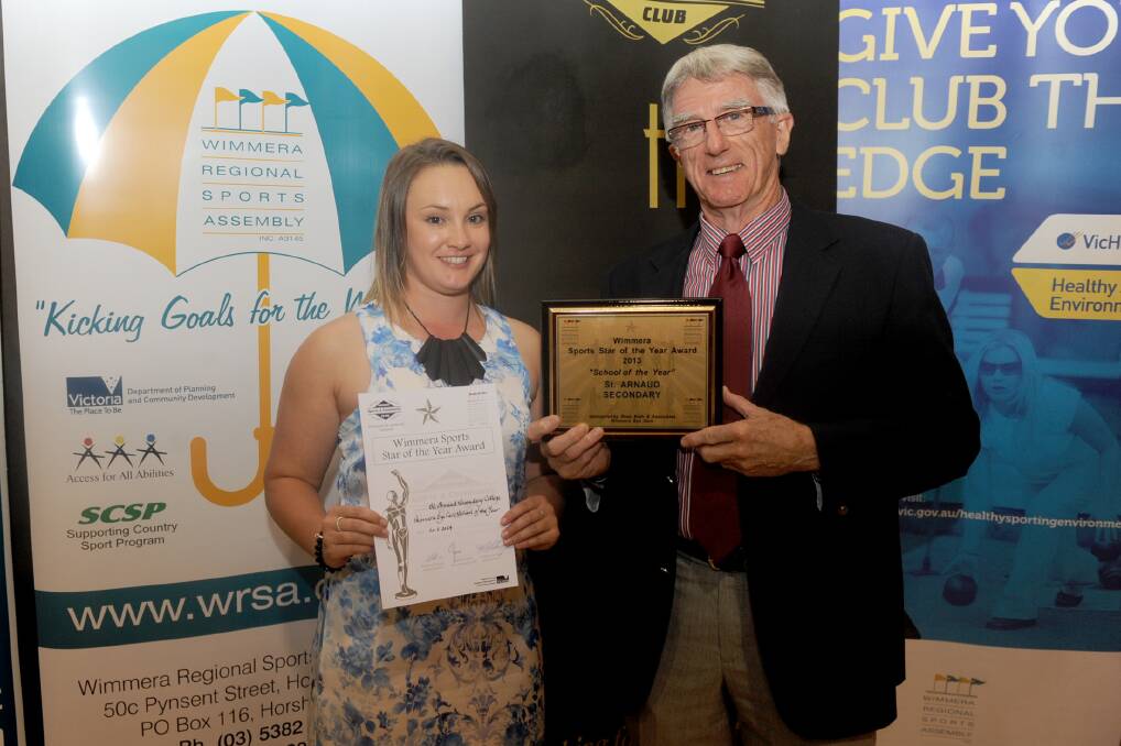 SCHOOL OF THE YEAR: St Arnaud Secondary College representative Maddi Longergan accepts the award from Ross Both.