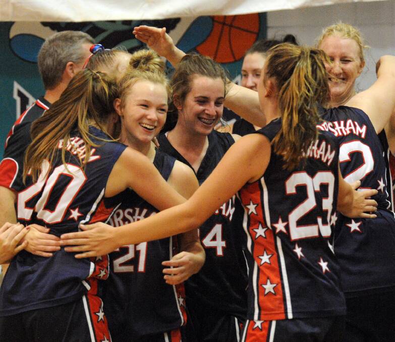 VICTORY: Horsham Hornets women’s team embraces after winning its first ever premiership on Saturday night.