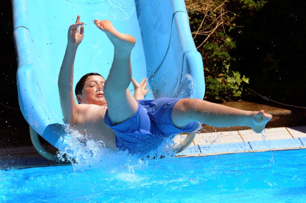 JANUARY: Caleb Robinson of Ararat enjoys a water slide at Stawell Leisure Complex as the mercury tipped into the high 30C.