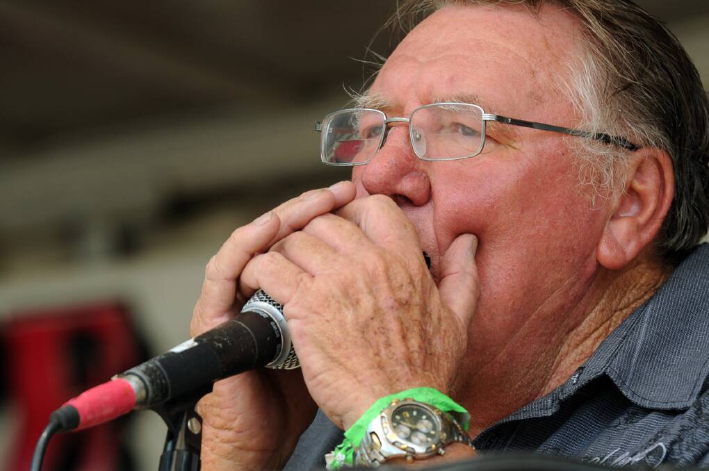 FEBRUARY: Eric Murray playing harmonica at Lake Charlegrark Country Music Festival.