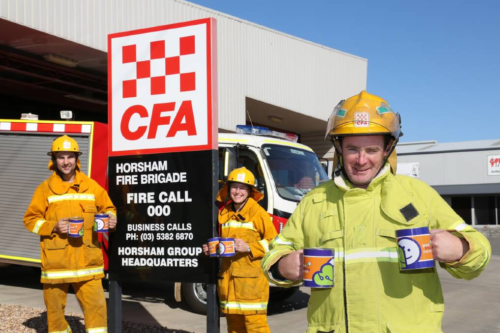 READY TO ROLL: Horsham Fire Brigade volunteers Jai Smith, Rachelle Johnson and John St Clair get ready to collect donations for the Royal Children’s Hospital Good Friday Appeal. Picture: THEA PETRASS