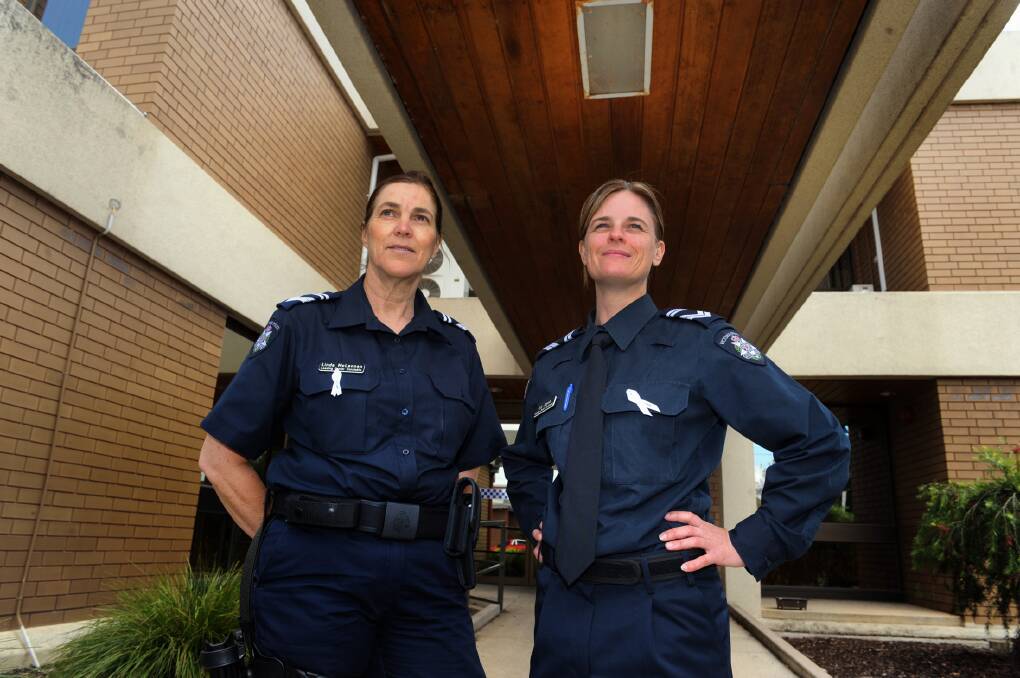 WE SAY NO: Leading Senior Constables Linda McLennan and Liz Joyce make a stand against violence against women on White Ribbon Day. Picture: PAUL CARRACHER