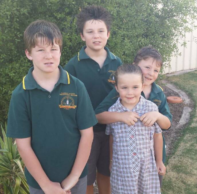Nicholas Shiells, grade six, and his siblings Trent, grade four, Brayden, grade two and Taleisha, prep, ready for their first day of school.