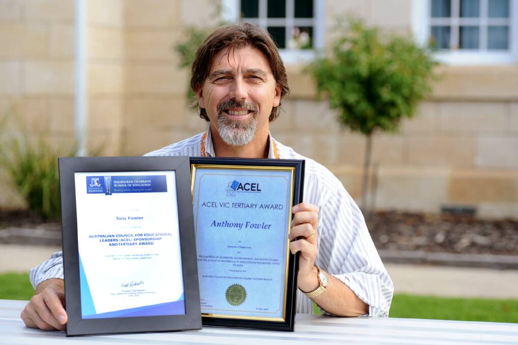 ACHIEVEMENT: Warracknabeal Secondary College principal Tony Fowler with one of his awards he won last week. He is also a finalist for Secondary Principal of the Year. Picture: SAMANTHA CAMARRI