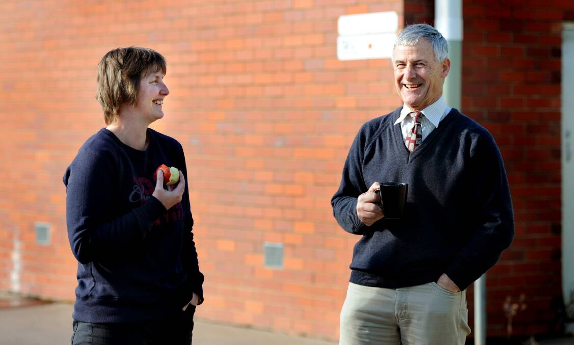 Keith Lockwood catches up with colleague Kelly Laird during morning tea. Picture: SAMANTHA CAMARRI